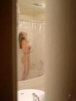 voyeur peep picture i took from behind the door of woman getting undressed and about to take a shower.